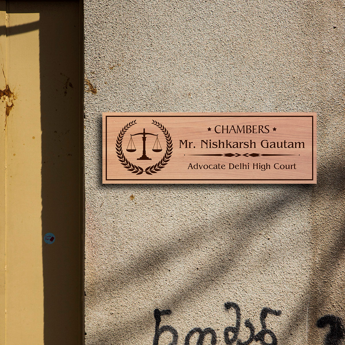 Walnut-print advocate name plate styled on an office door