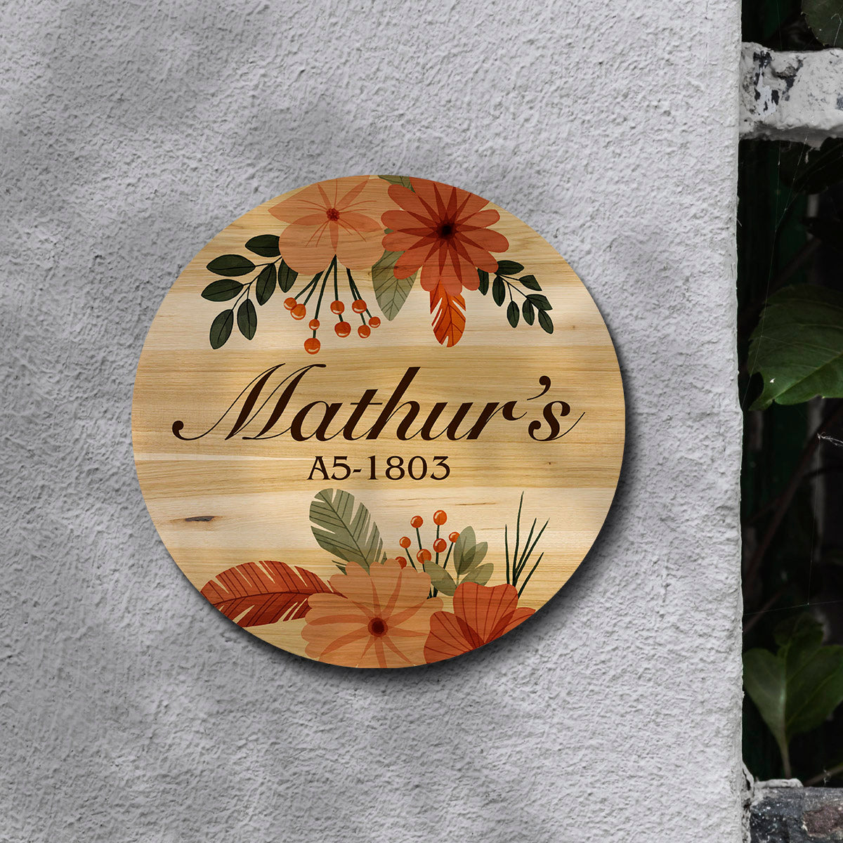 Boho-style round door nameplate styled on a wall with warm earthy folk patterns