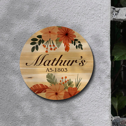 Boho-style round door nameplate styled on a wall with warm earthy folk patterns